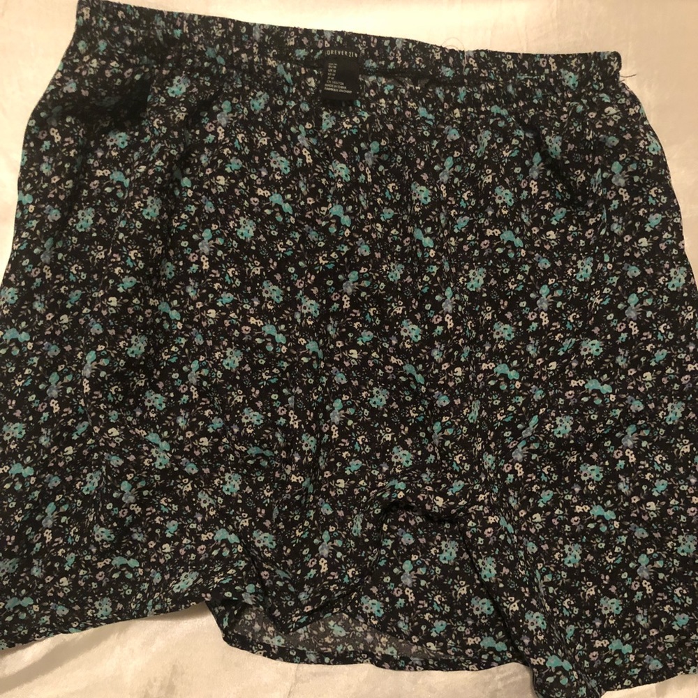 Black mini skirt with blue and white flowers